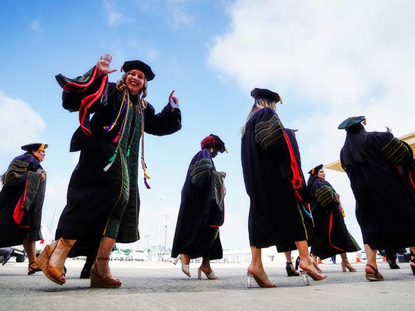 Graduate at commencement checking in