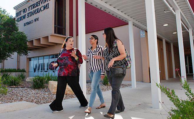 Adult students walking through the Incarnate Word Northwest Campus