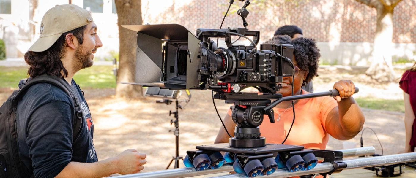 Students preparing a camera for filming