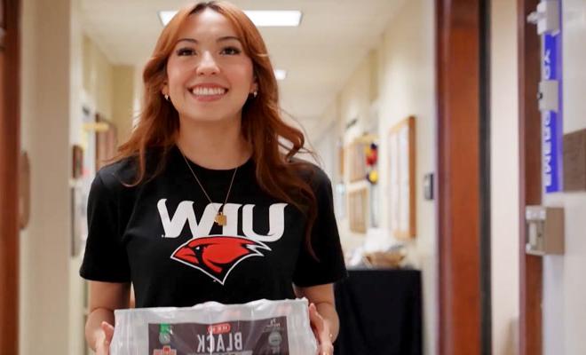 Student Helping in Thanksgiving Food Drive